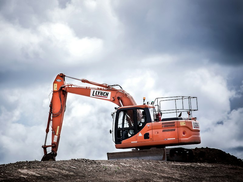 Concrete plant and site machinery working a reinforced frame